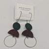 Metal Rings on Black Leather Semicircles and Green Leather Earrings
